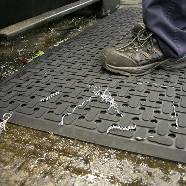 Rubber Mats for the Win: The Top 5 Reasons Why Businesses Choose Them 1 Rubber mat with holes